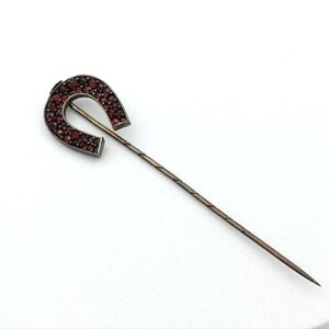 Antique Victorian era garnet sterling good luck horseshoe stick pin.